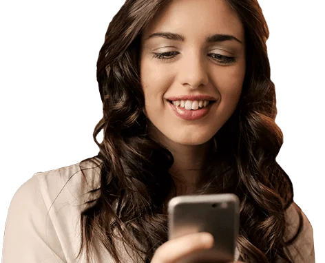smiling brunette woman looking at HCi OMS on a mobile phone ~ health insurance made easy » HCi