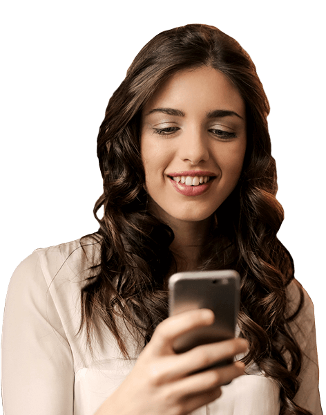 smiling brunette woman looking at a mobile phone