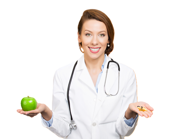 Smiling doctor holding an apple in one hand and medicine in the other - representing making healthy choices such as good health cover » HCi